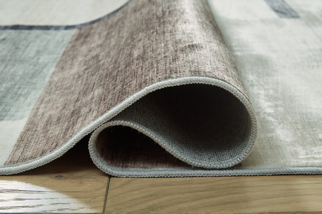 Larkport Washable Area Rug - Vida Furniture (Laredo,TX)
