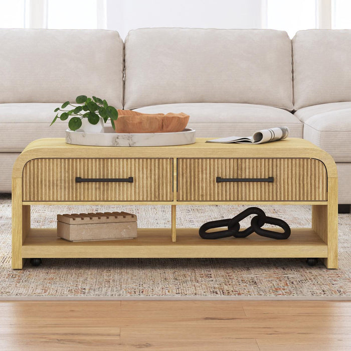 Ridgemont Coffee Table with Casters/Push Through Drawer in Natural - Vida Furniture (Laredo,TX)